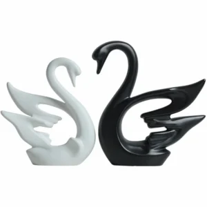 statuette cygnes sur fond blanc